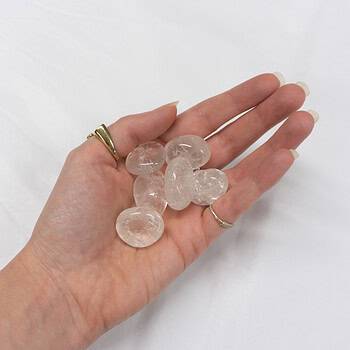 A handful of clear quartz tumbles