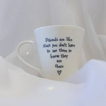 A White porcelain mug that says "Friends are like stars you dont have to see them to know they are there"