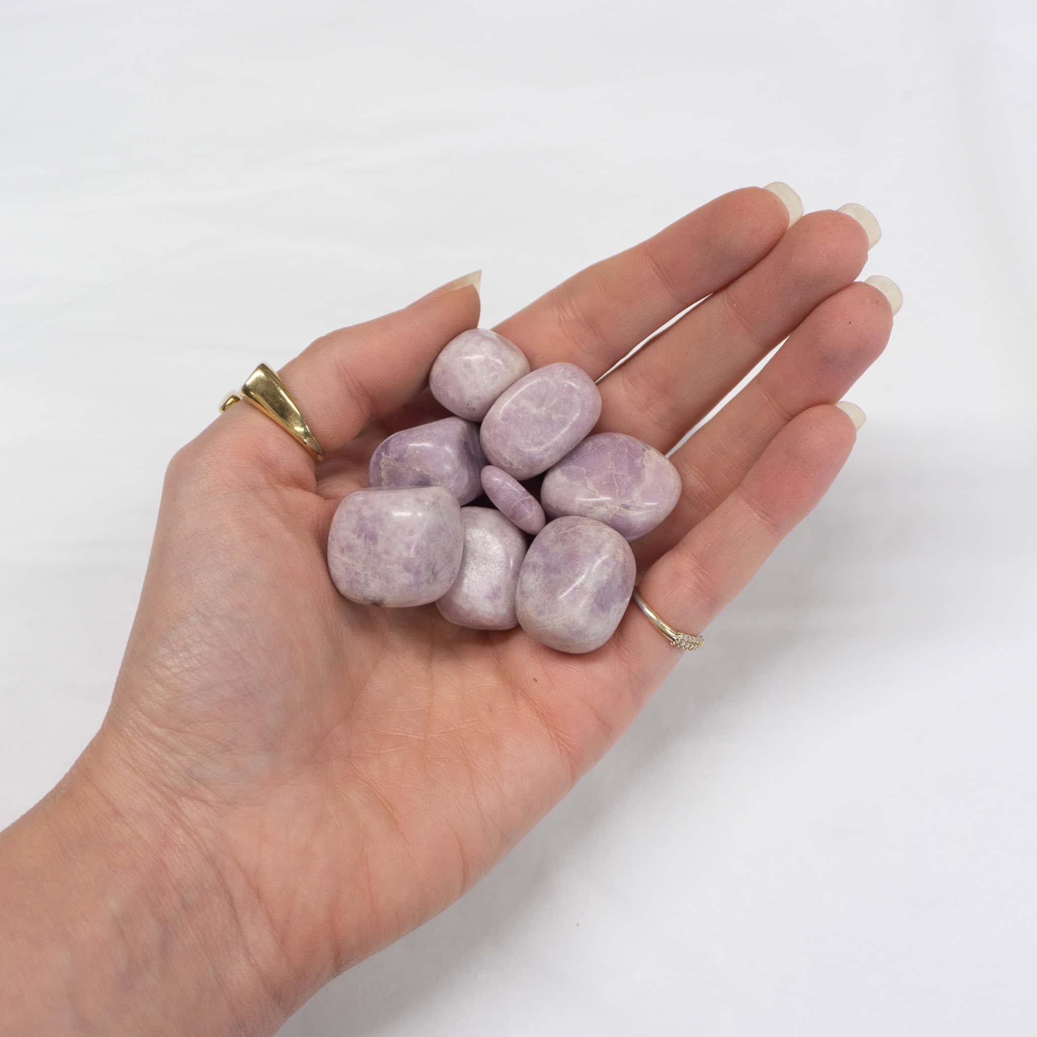 lilac lepidolite A handful of lilac lepidolite tumbles